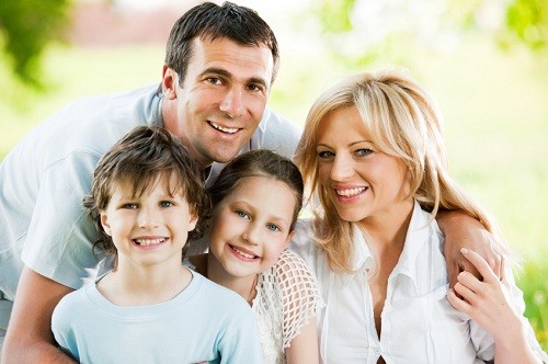 Family of four hugging in Ogdensburg, Ogdensburg.